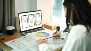 A woman designing new UX/UI screens